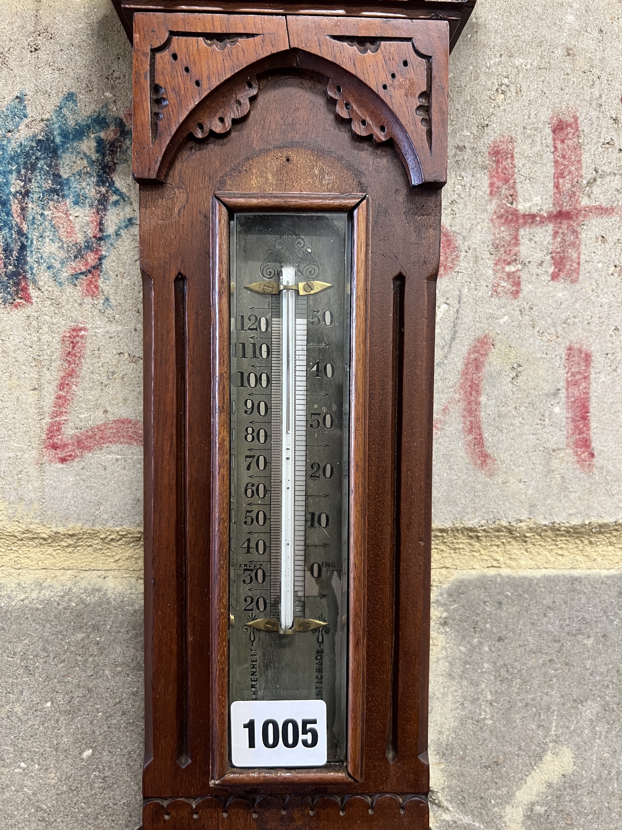 A Victorian walnut cased aesthetic movement style aneroid barometer and thermometer, Negretti & Zambra, London, numbered 7342, height 68cm